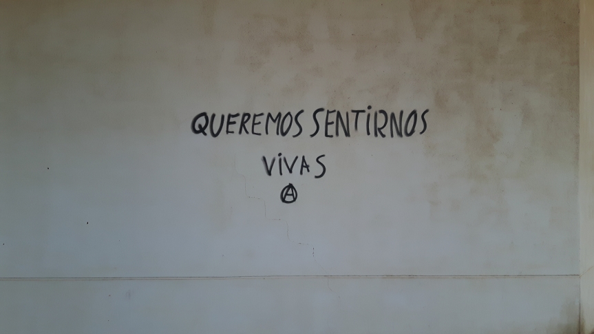 black graffiti on white wall
